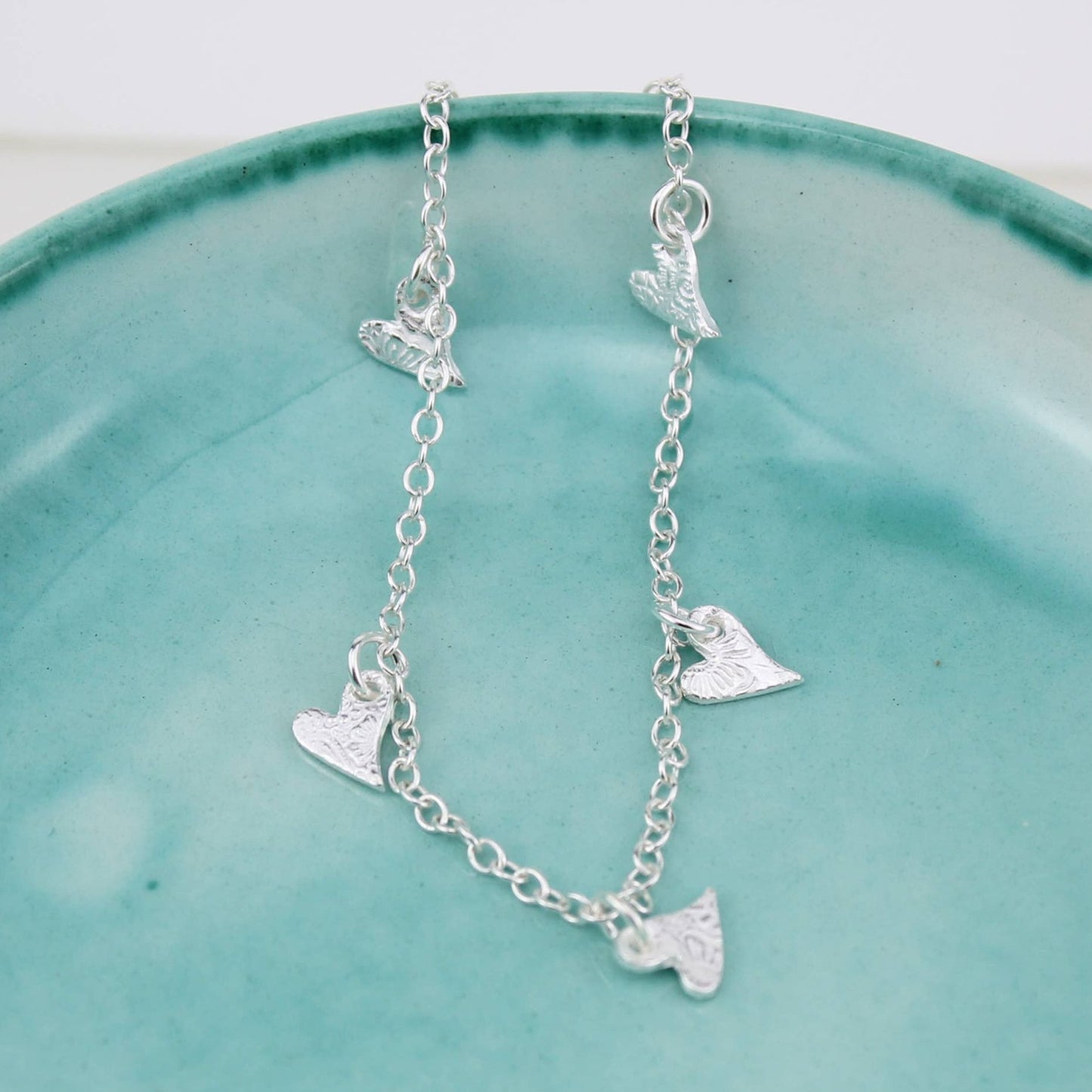 Sterling silver tilted heart charm bracelet