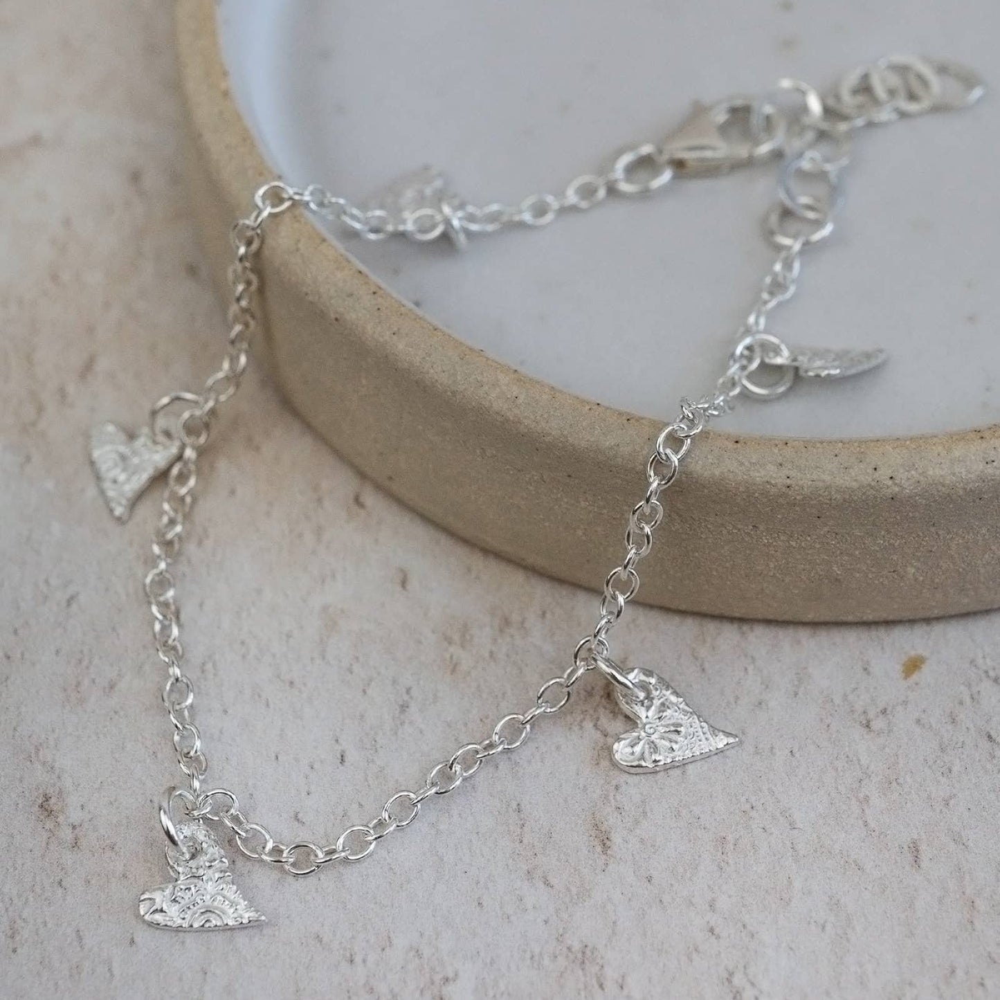 Sterling silver tilted heart charm bracelet