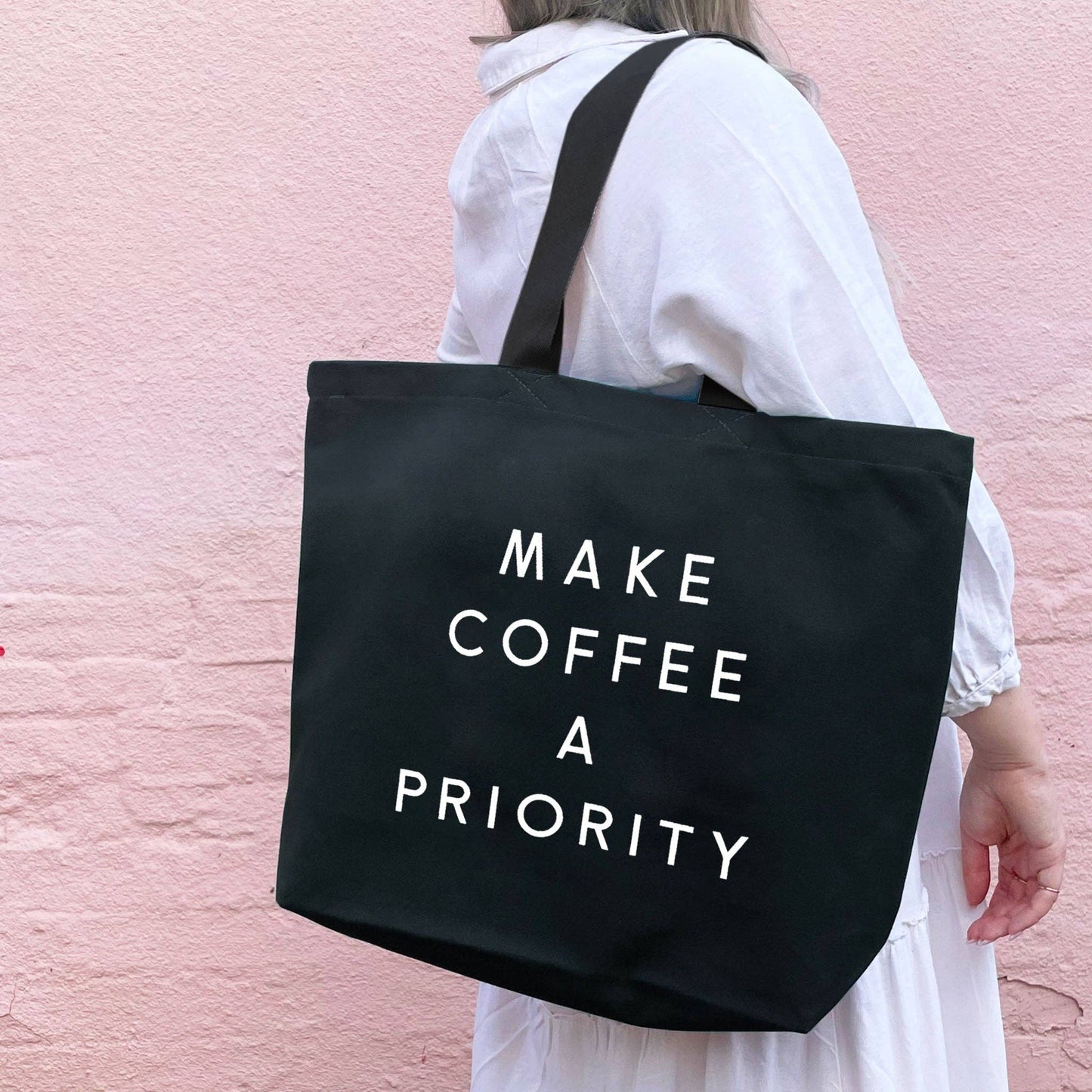 Make coffee a priority - black canvas tote bag