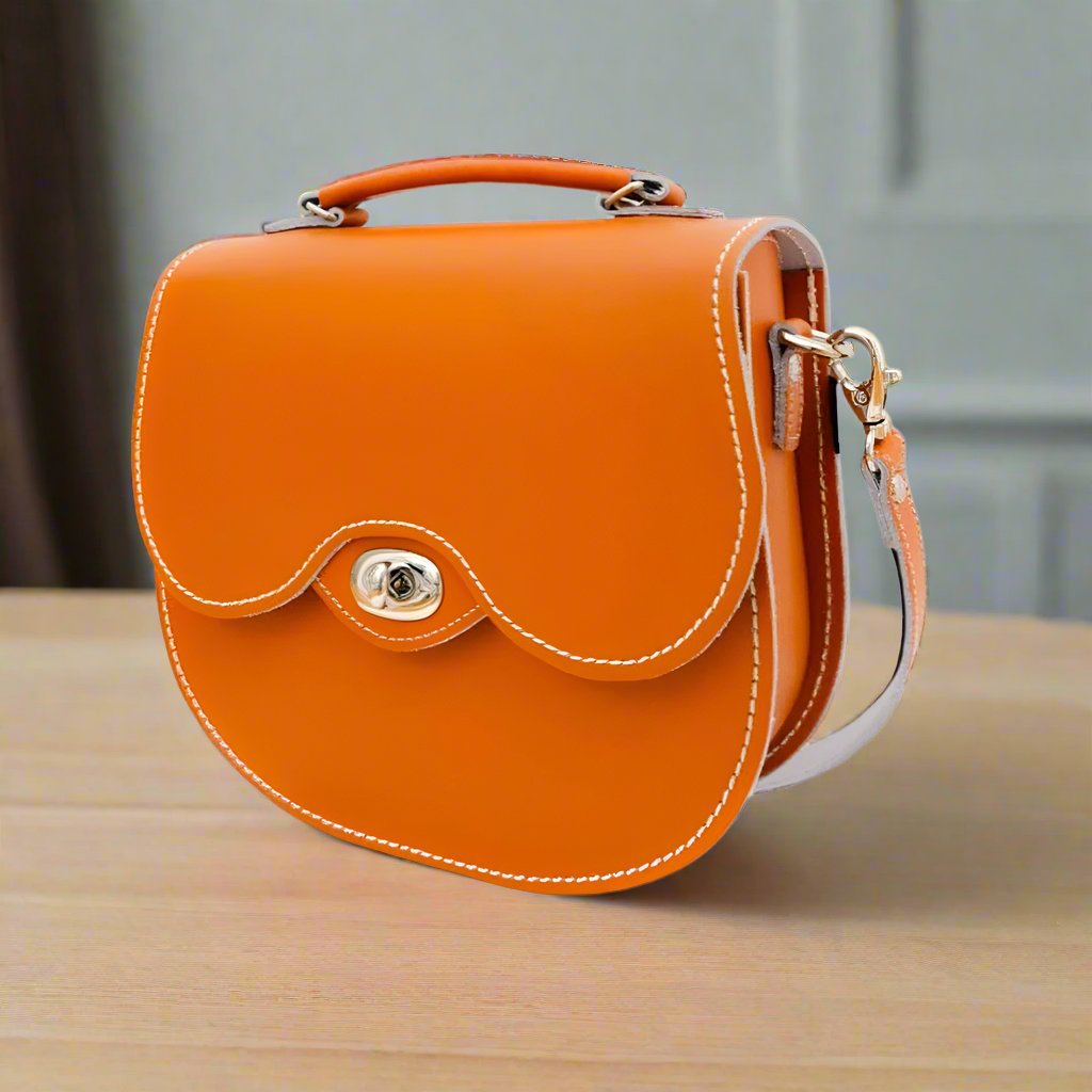 Orange handmade leather twist lock saddle bag