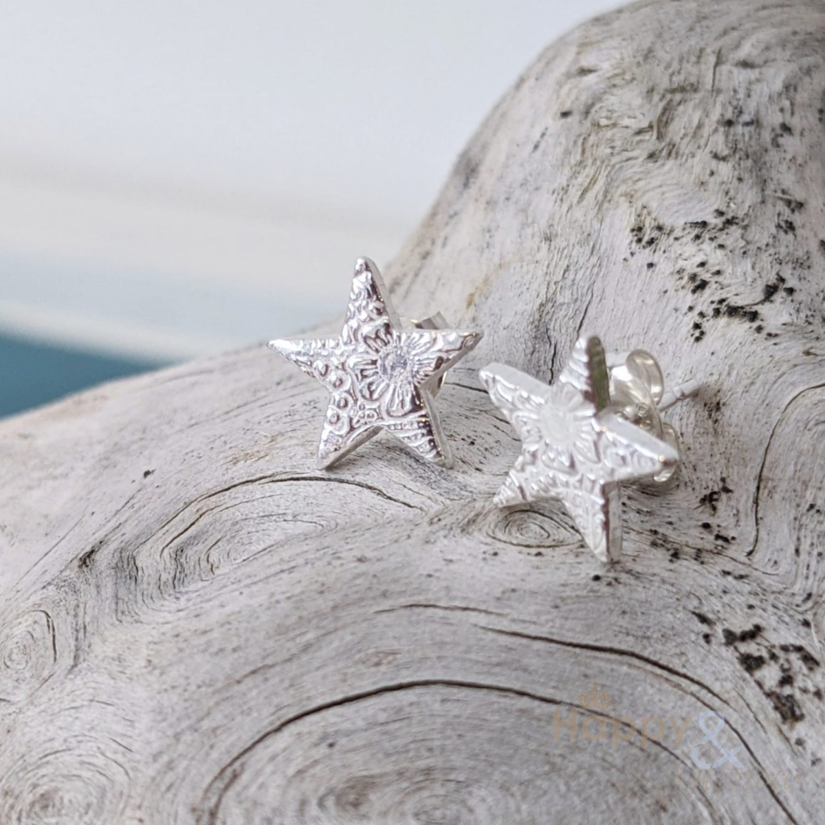 Sterling silver textured star stud earrings