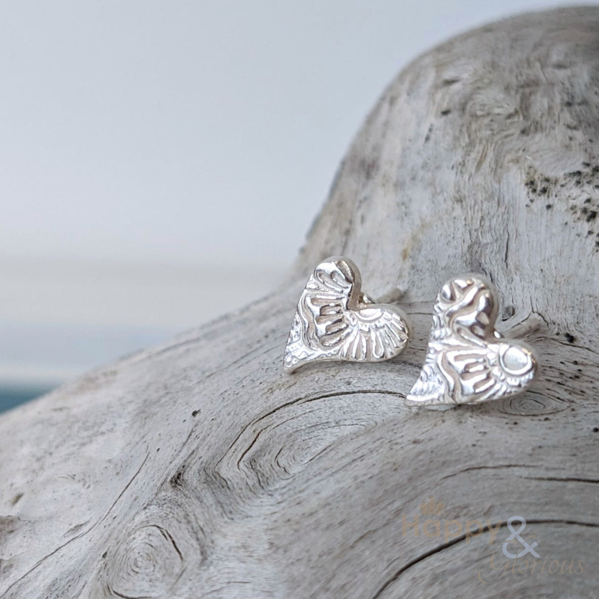 Sterling silver tilted textured heart earrings