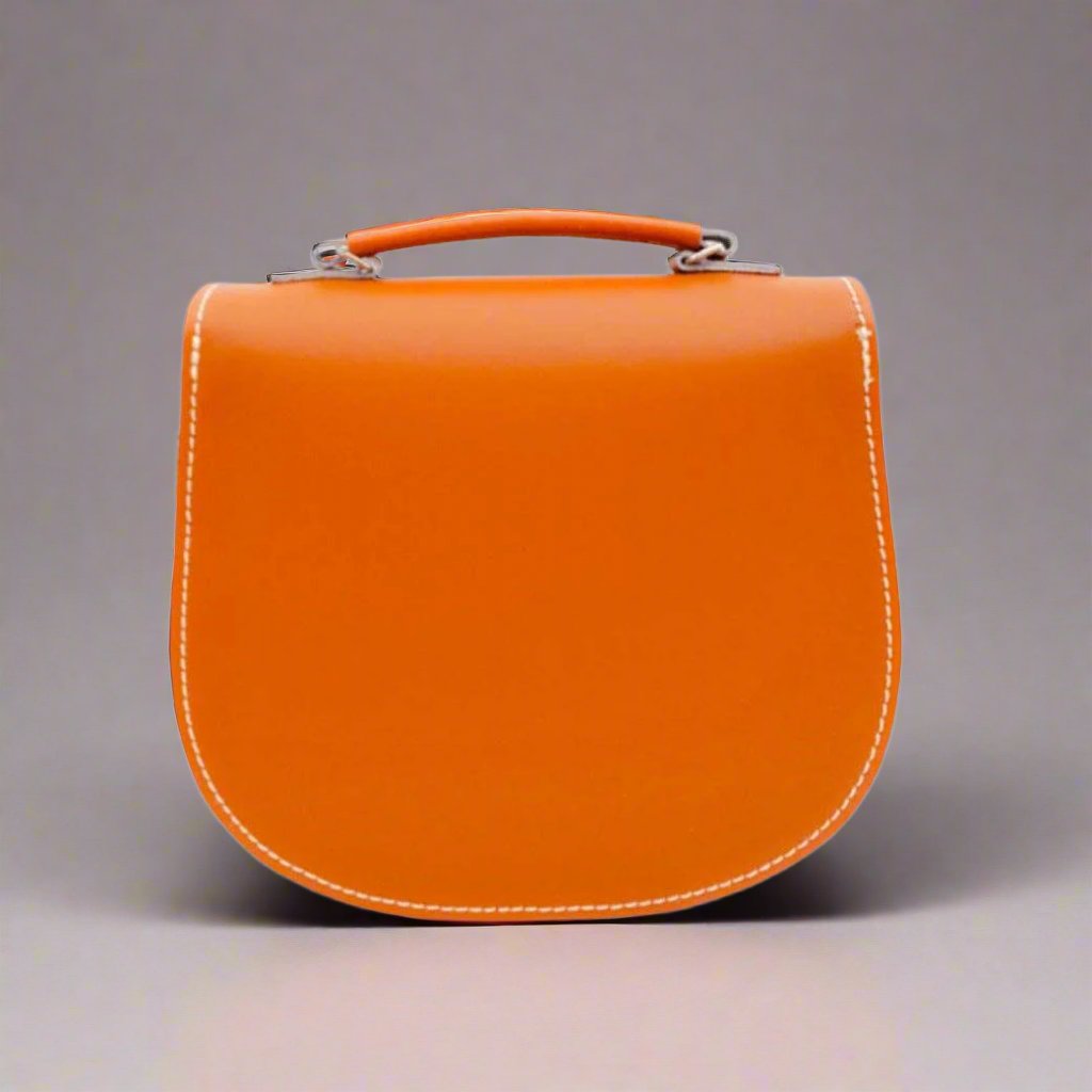 Orange handmade leather twist lock saddle bag