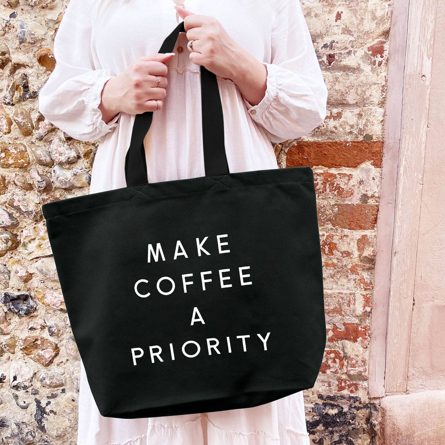 Make coffee a priority - black canvas tote bag