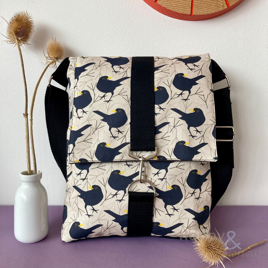 Blackbird print messenger bag