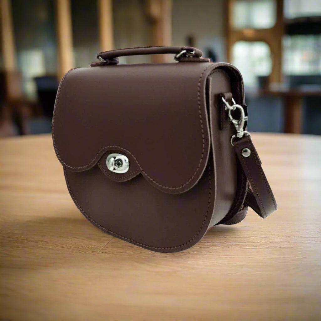 Handmade dark brown leather twist lock saddle bag