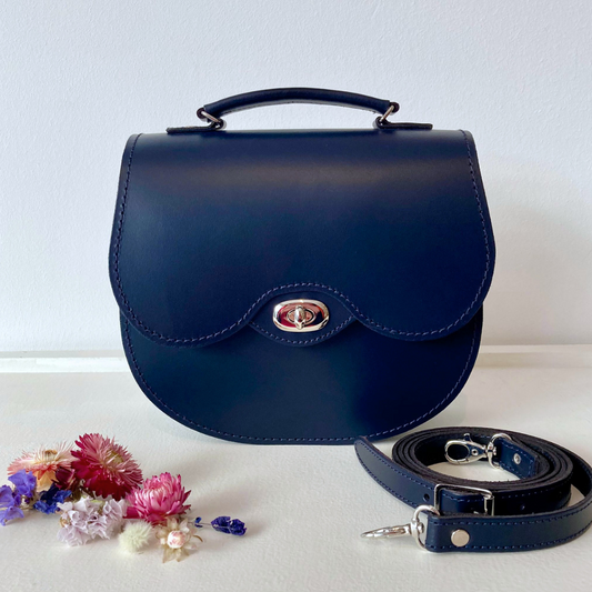 Navy twist lock leather saddle bag