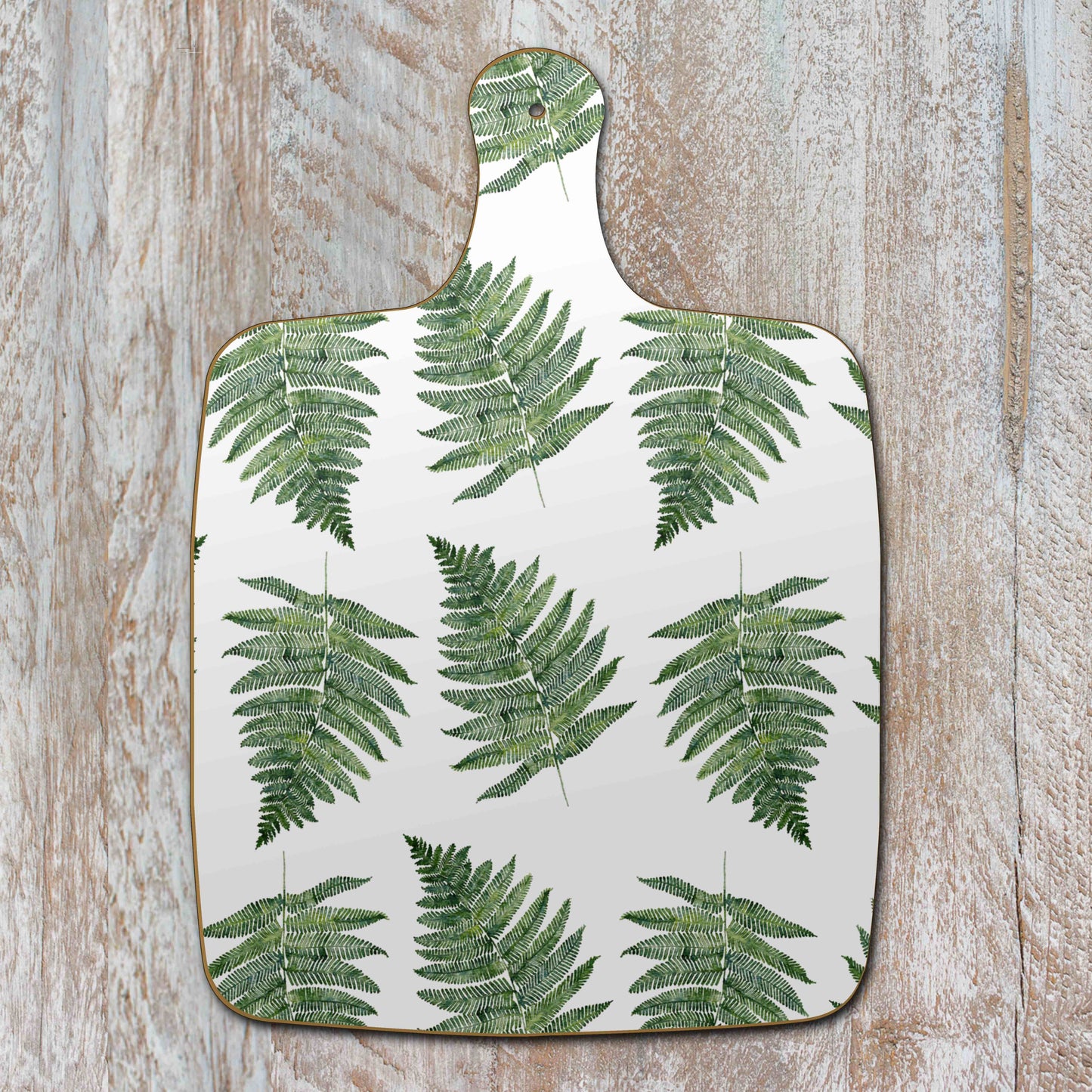 Ferns on white chopping board